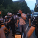 Police surround Jacob Wohl as he taunts protesters in DC on Aug. 27, 2020.